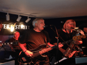 John on stage with the band